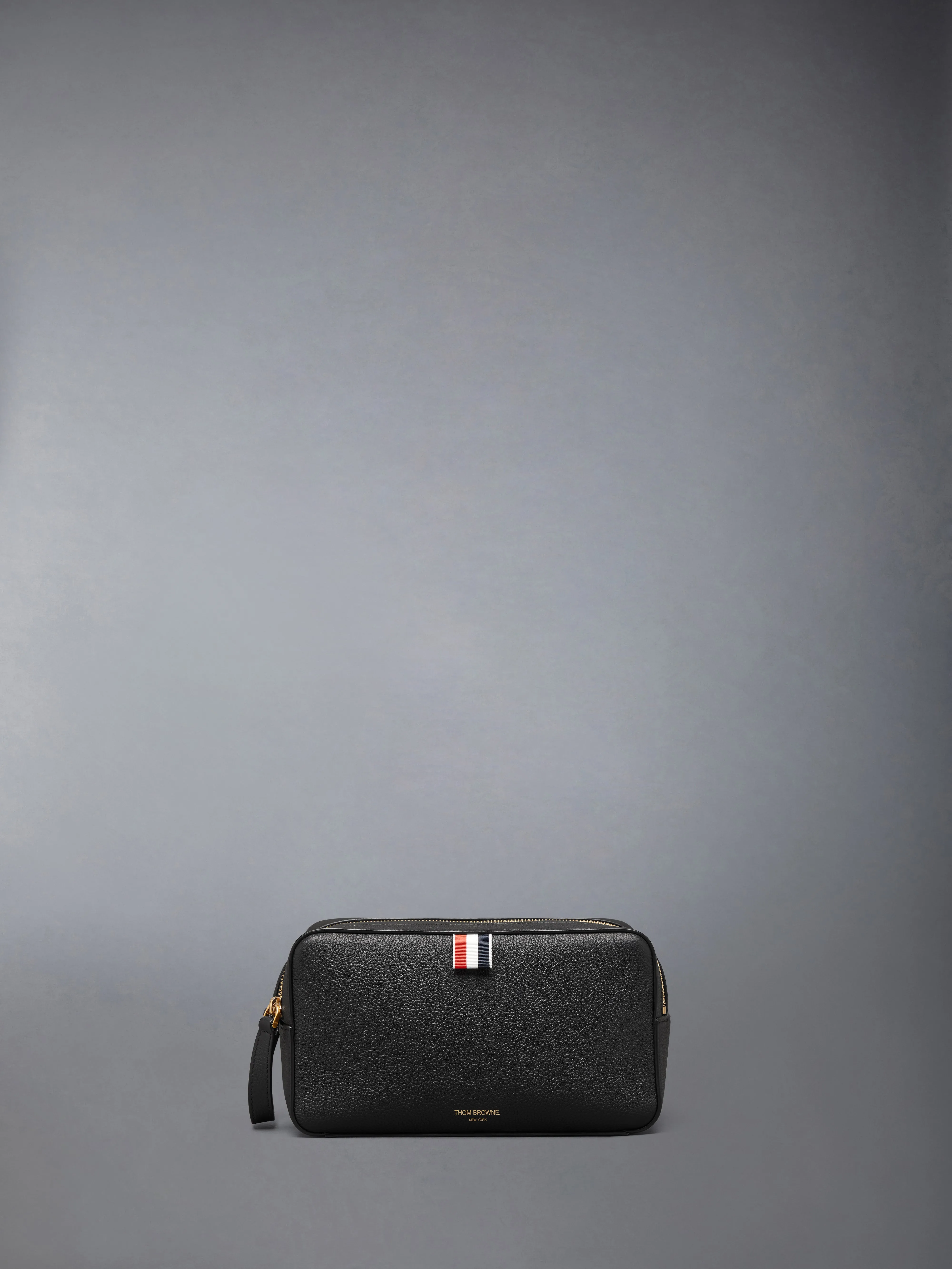 WASH BAG IN SOFT PEBBLE GRAIN LEATHER sold by Thom Browne