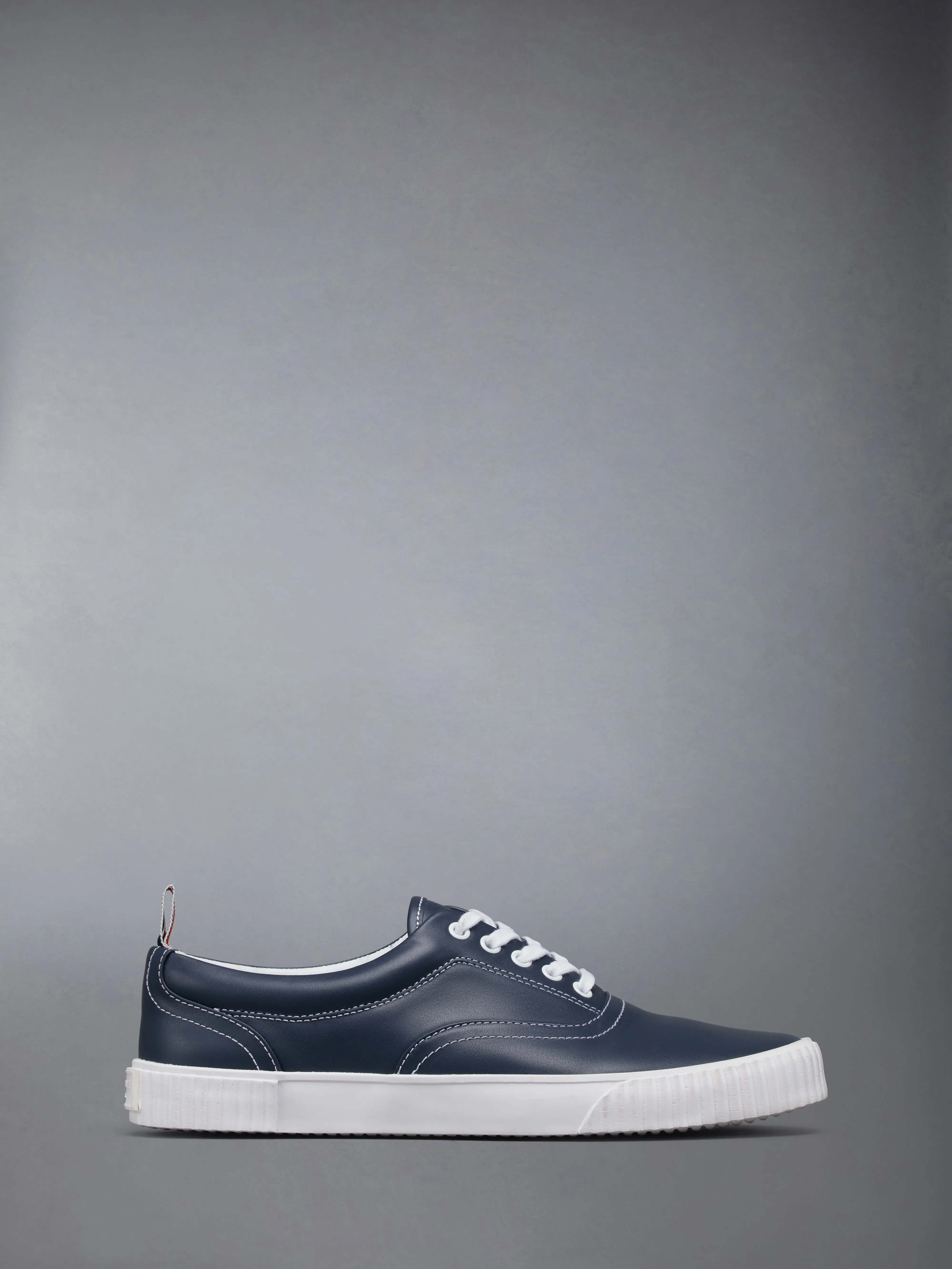 VITELLO LEATHER HERITAGE SNEAKERS WITH VULCANIZED SOLES sold by Thom Browne
