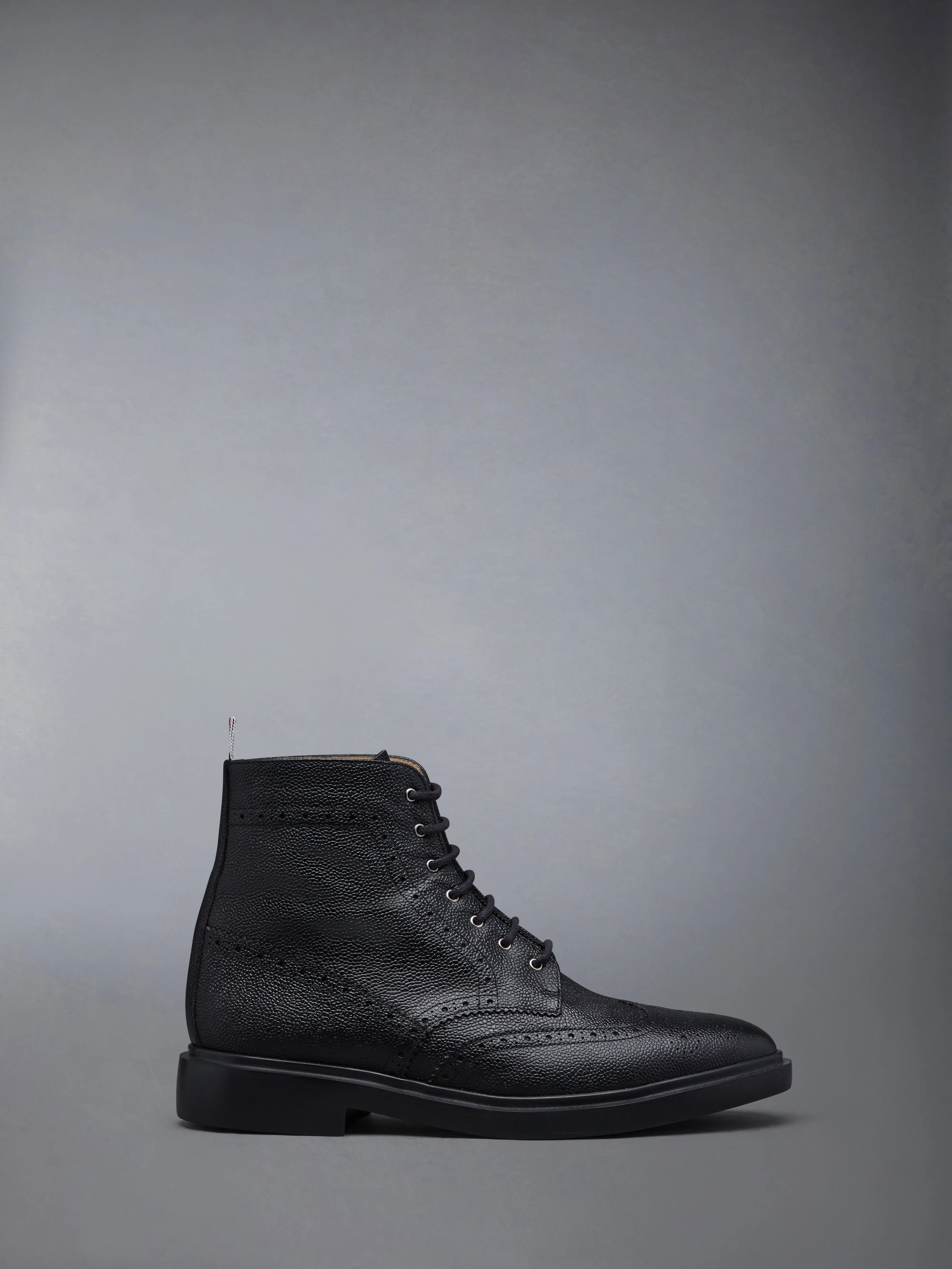 PEBBLE GRAIN LEATHER WINGTIP BOOTS WITH RUBBER SOLES sold by Thom Browne