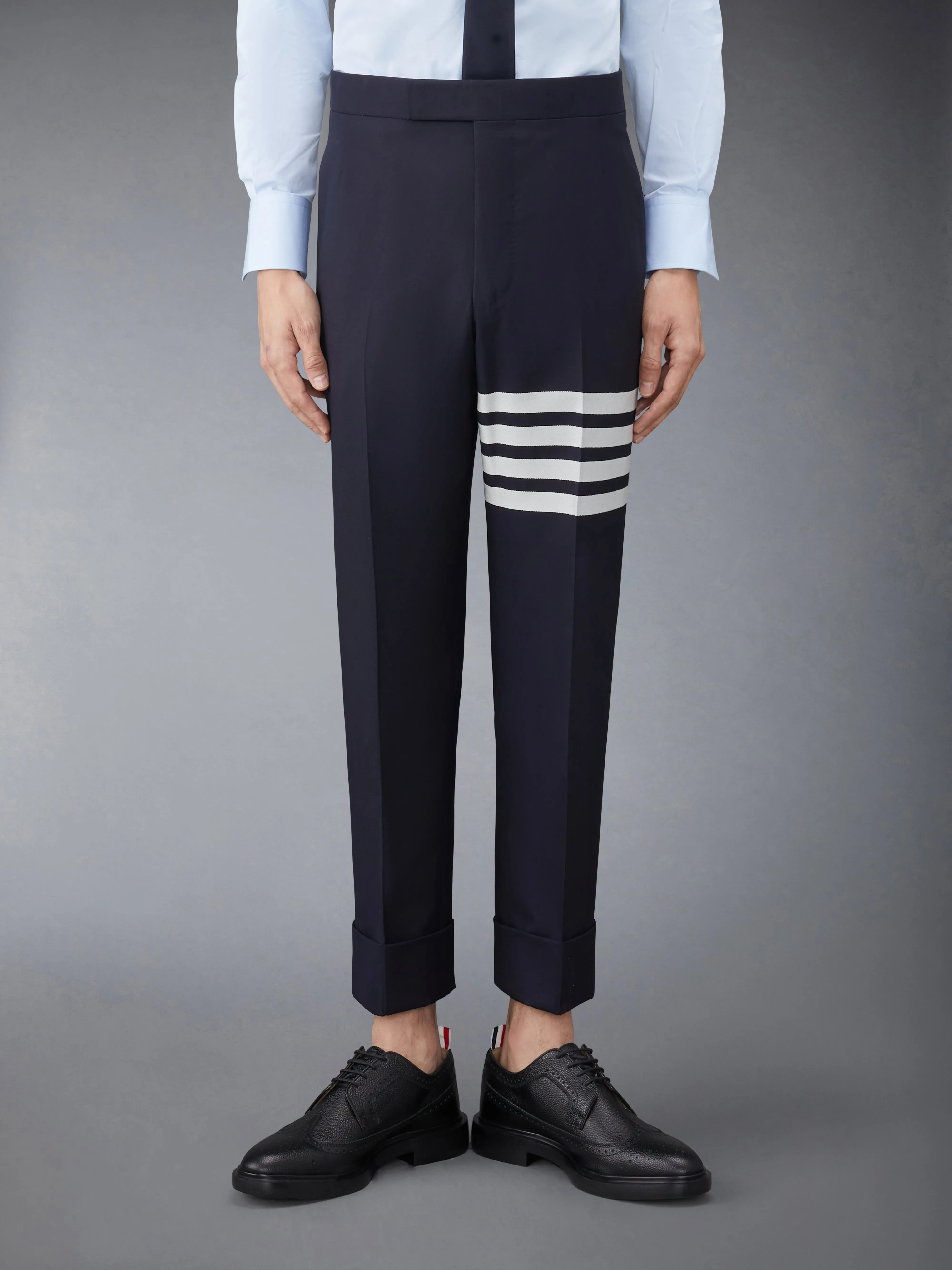 PLAIN WEAVE 4-BAR BACKSTRAP TROUSERS sold by Thom Browne