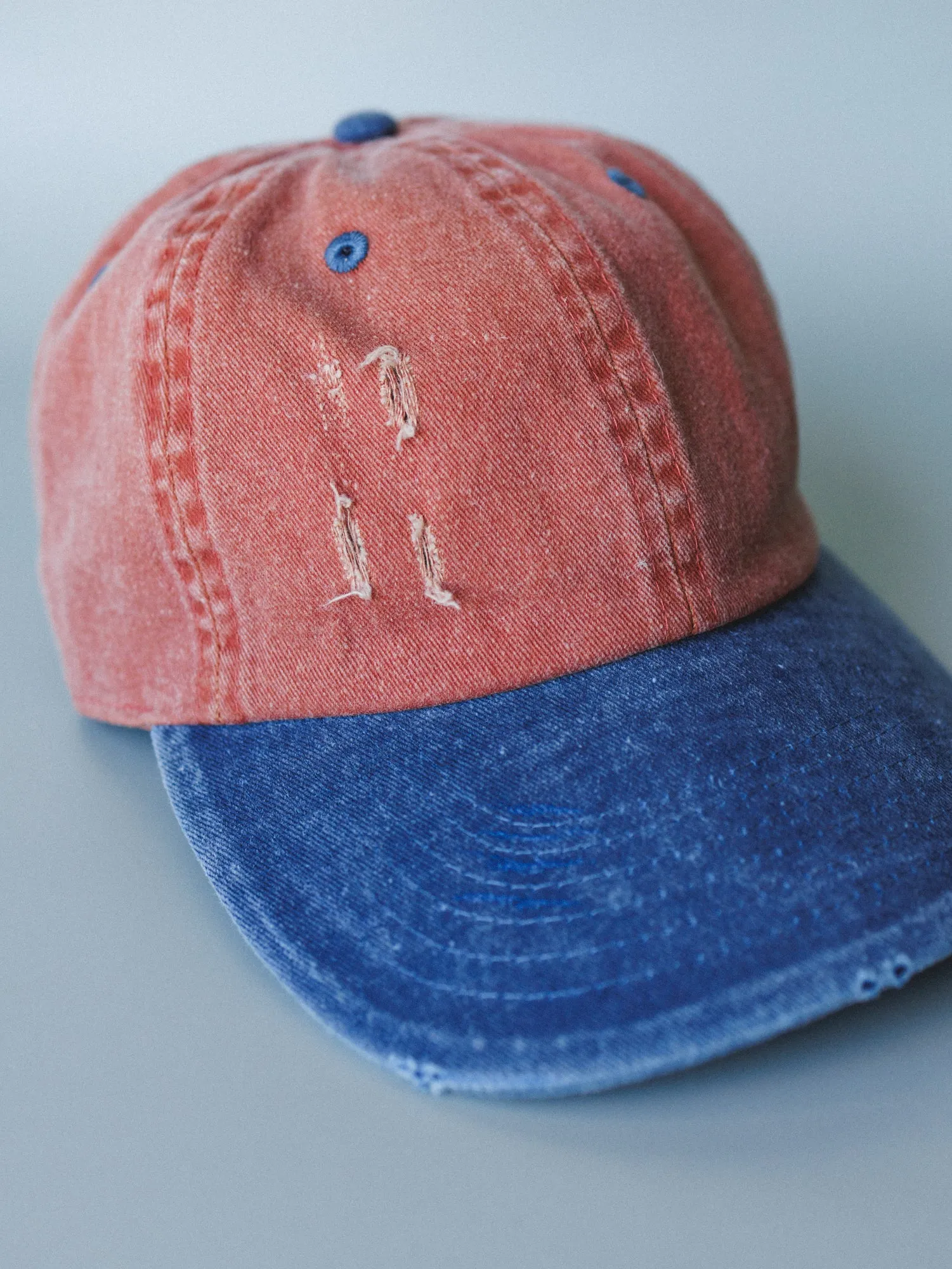 Distressed Baseball Cap Dad Hat
- Two Tone Orange Blue sold by Three Bird Nest