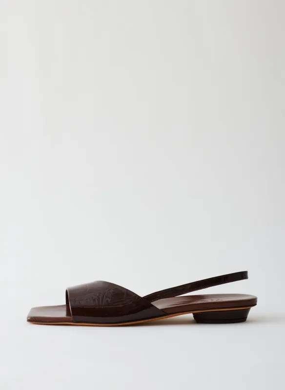 Avi Crinkle Patent Asymmetric Flat sold by Tibi