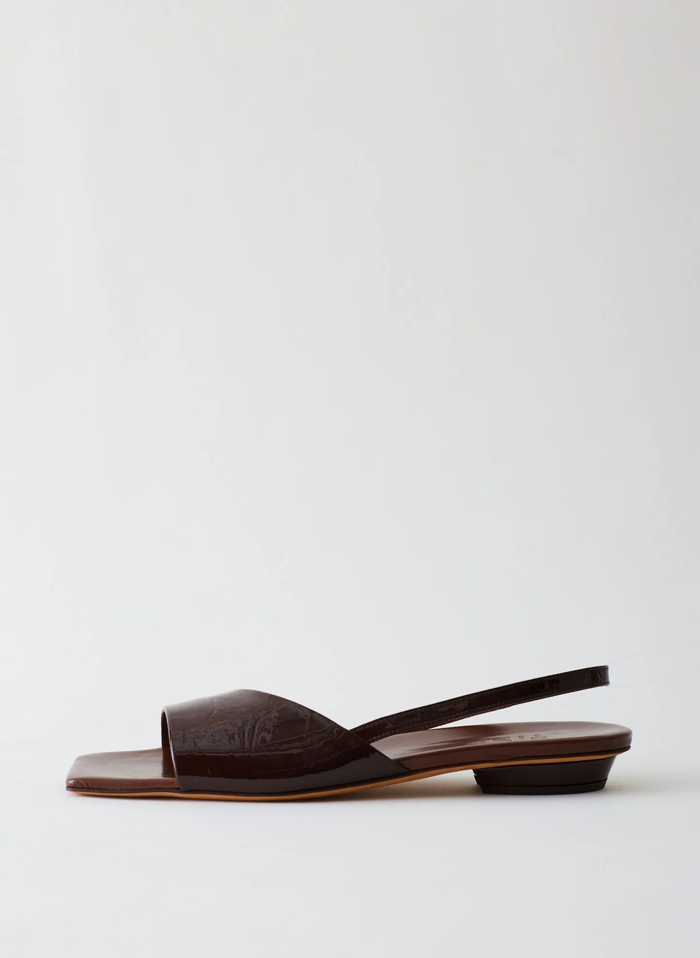 Avi Crinkle Patent Asymmetric Flat sold by Tibi