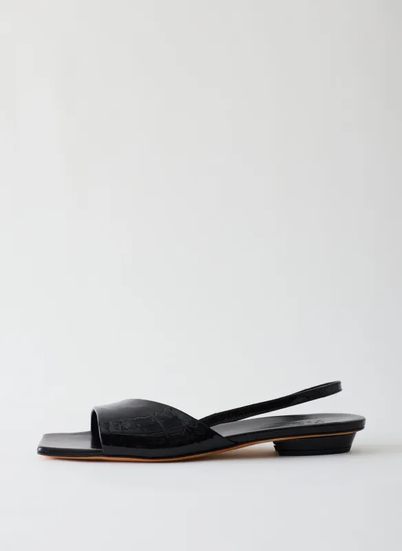 Avi Crinkle Patent Asymmetric Flat sold by Tibi
