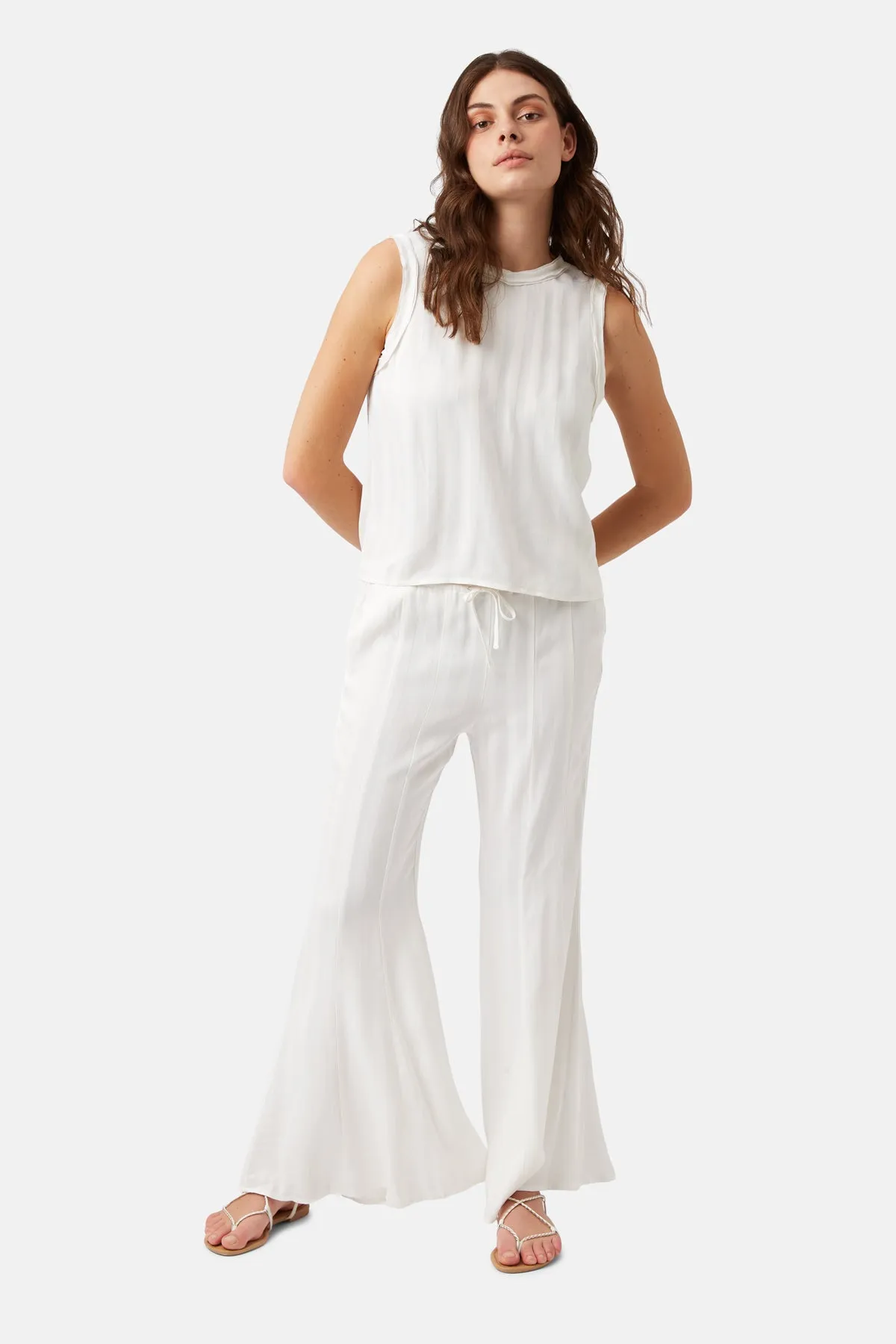 Telling Stories Kick Flare Trousers in White sold by Traffic People