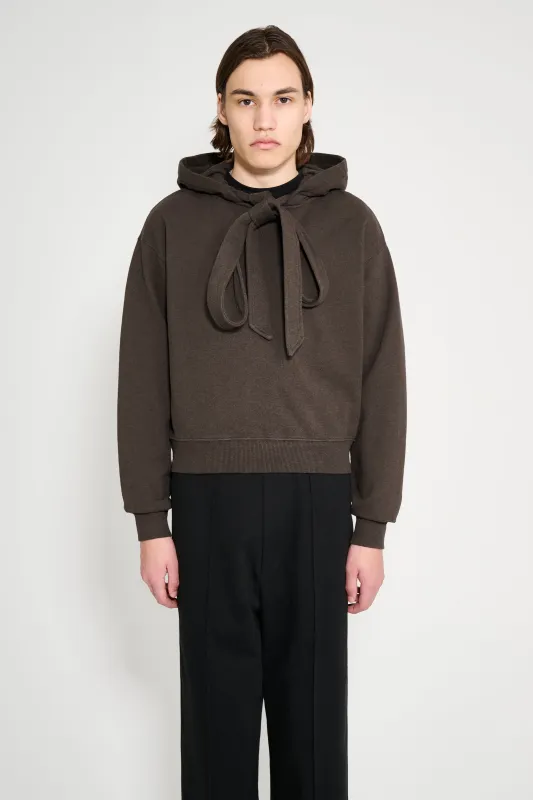 JW Anderson Tied Bow Hoodie Dark Brown Melange sold by Tres Bien
