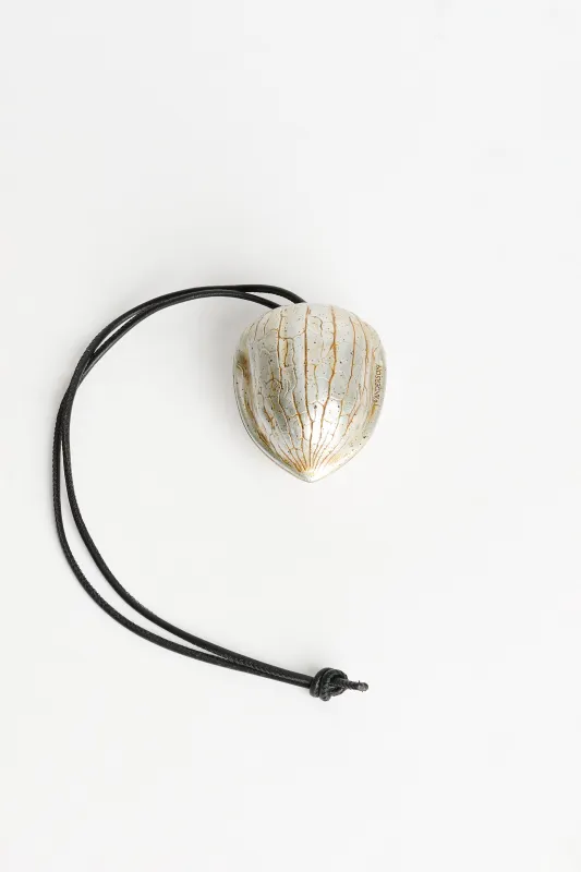 JW Anderson Walnut Keyring Aged Gold sold by Tres Bien