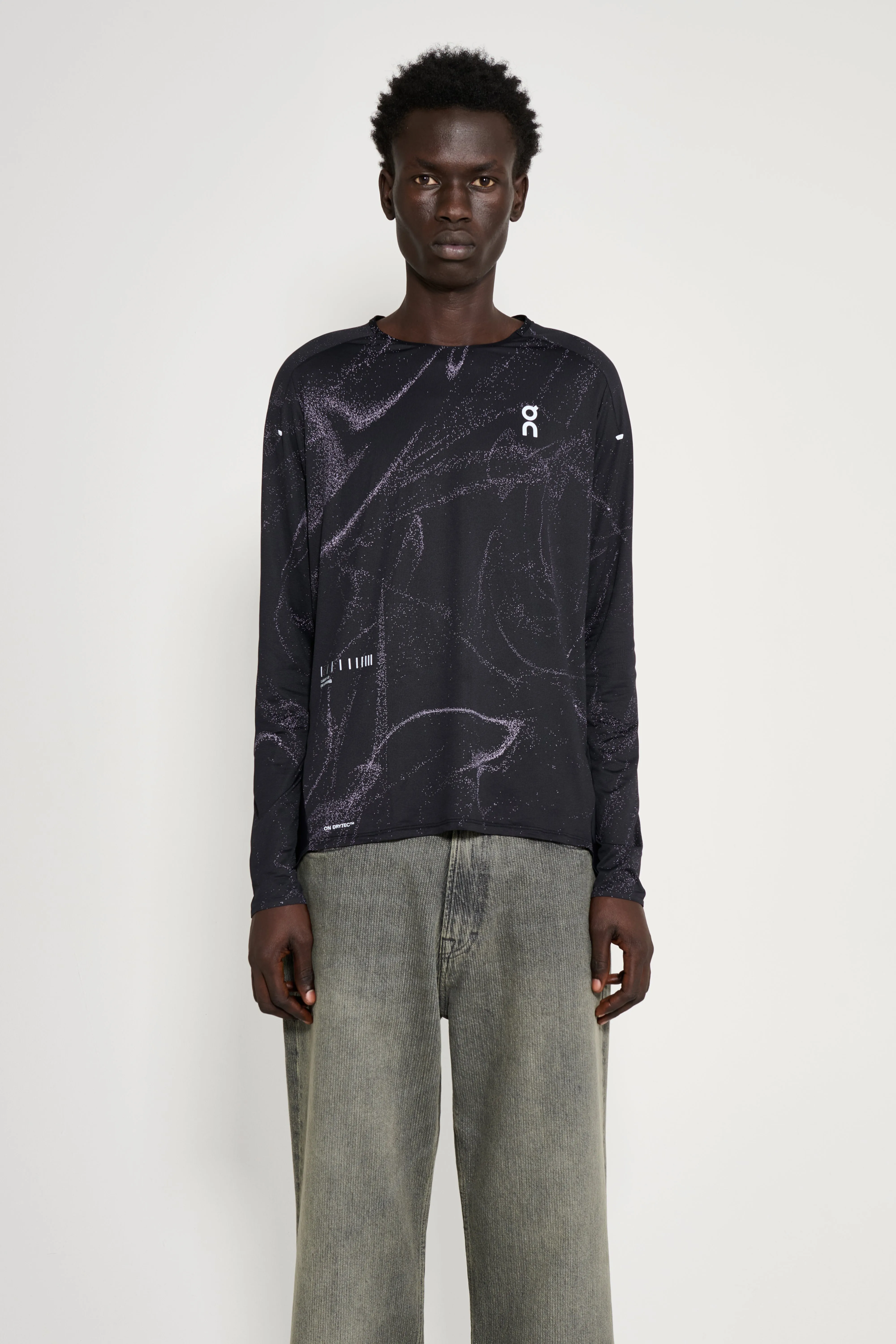 On Performance Long-T Lumos Black sold by Tres Bien