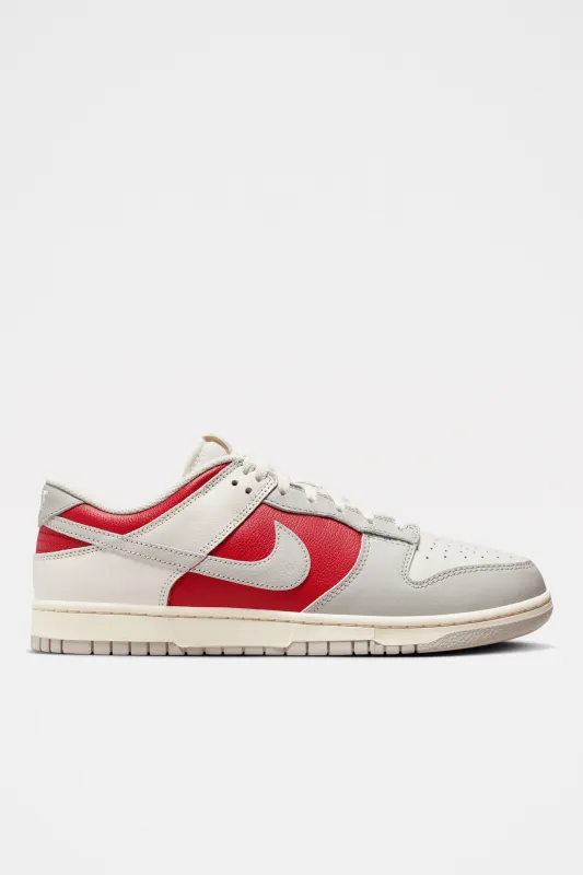 Nike Dunk Low Retro Phantom / Gym Red sold by Tres Bien