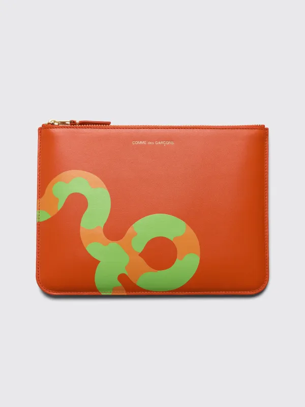 Comme des Garçons Wallet SA5100 Ruby Eyes Orange sold by Tres Bien