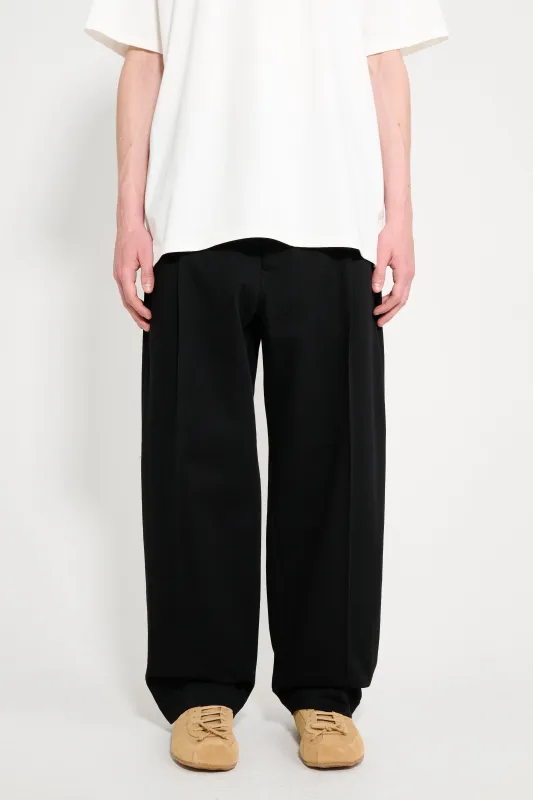 Lemaire Pleated Carrot Pants Black sold by Tres Bien