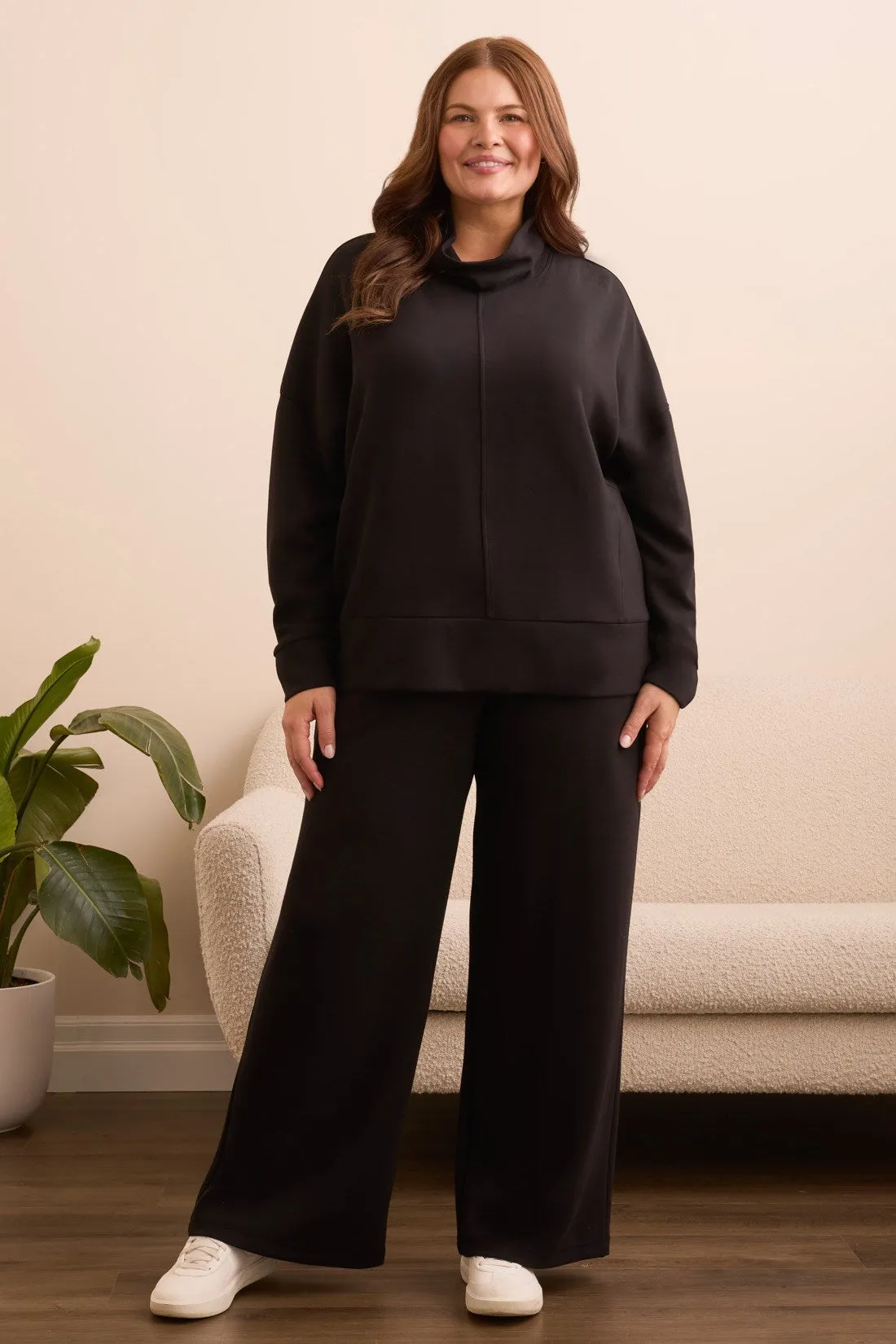 Techno Lux Drop Shoulder Funnel Neck Knit Top-Black sold by Tribal