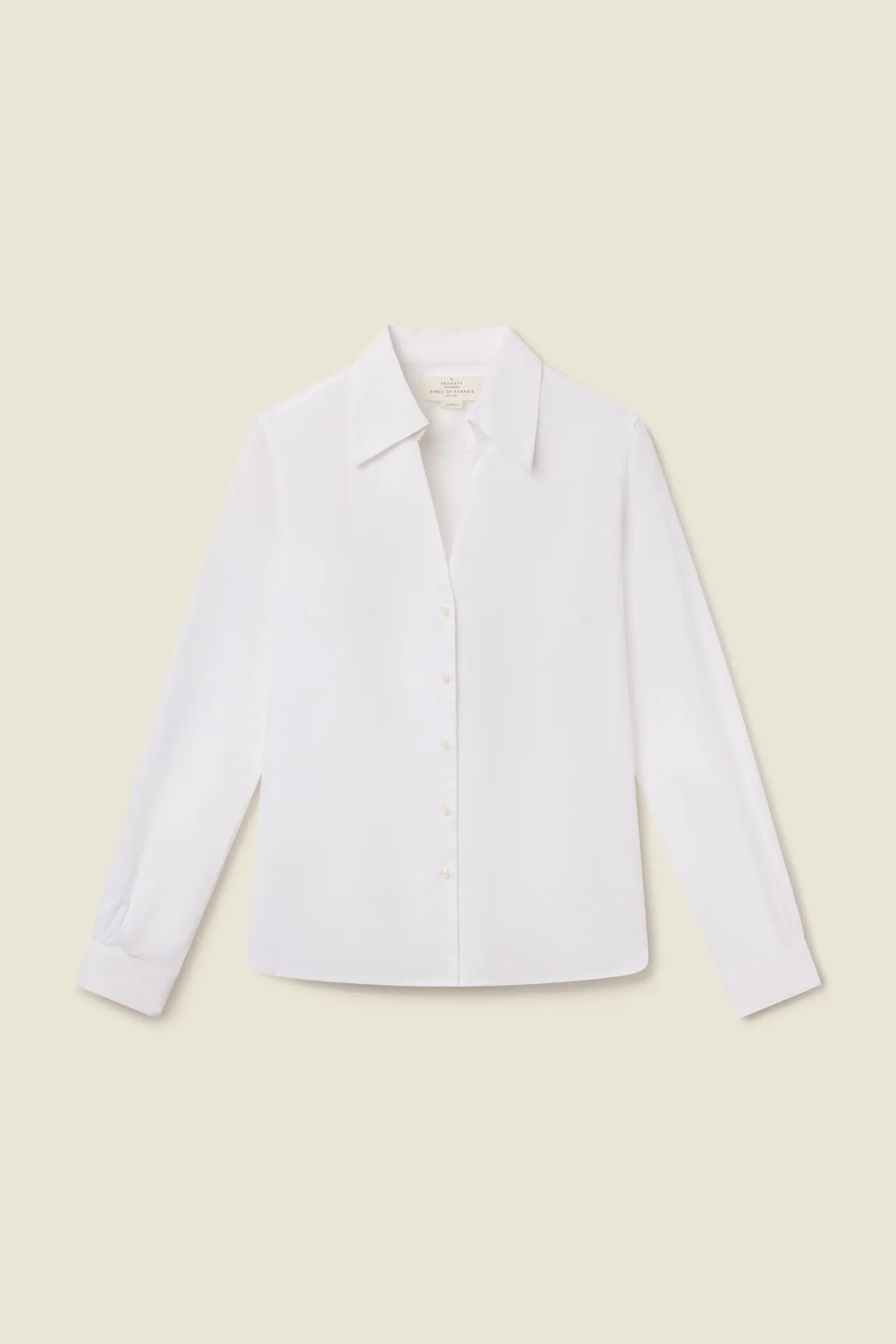Justine Blouse White sold by Trovata