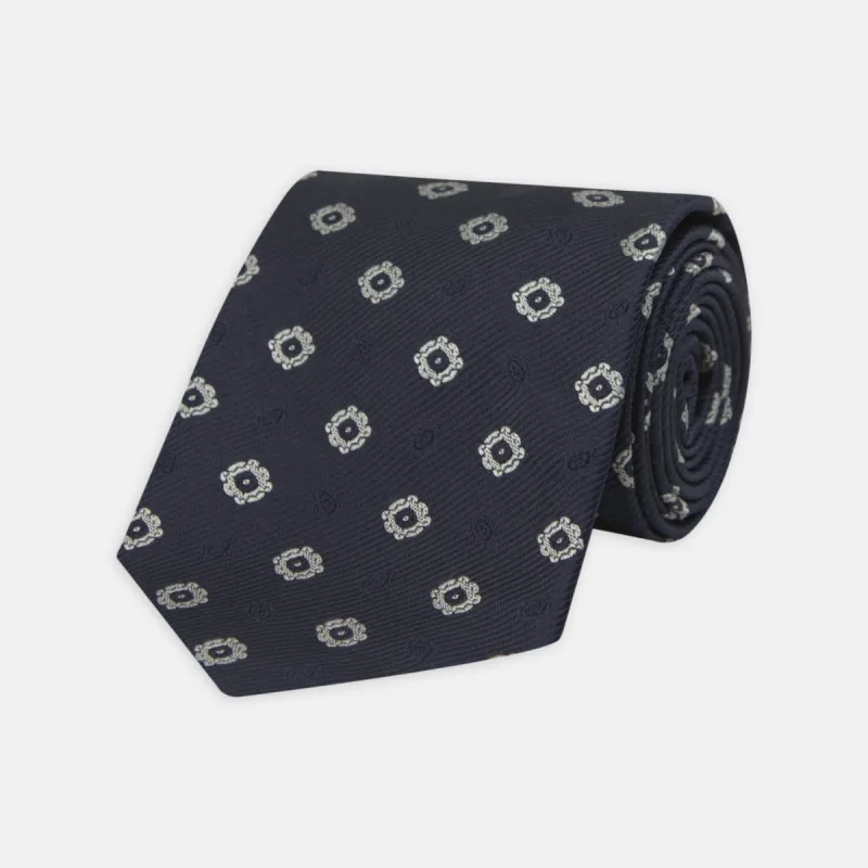 Navy and Silver Emblem Spot Silk Tie sold by Turnbull & Asser