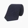 White and Navy Spot Printed Silk Tie sold by Turnbull & Asser