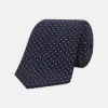 White and Navy Spot Printed Silk Tie sold by Turnbull & Asser