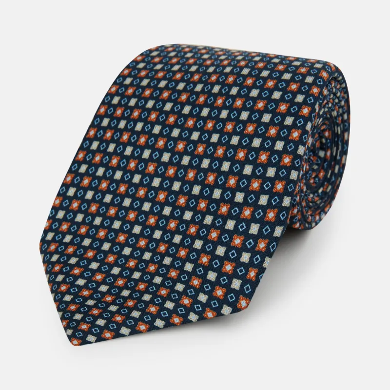 Navy and Orange Geometric Motif Silk Tie sold by Turnbull & Asser