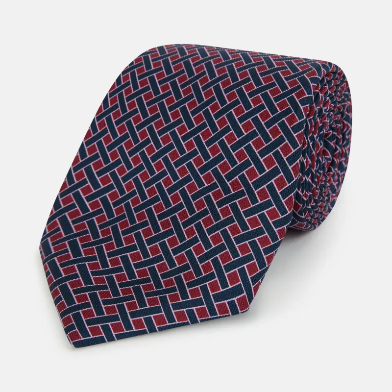 Navy and Pink Woven Printed Silk Tie sold by Turnbull & Asser