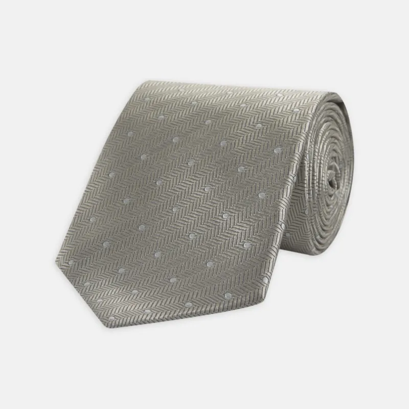 Silver and White Small Spot Herringbone Silk Tie sold by Turnbull & Asser