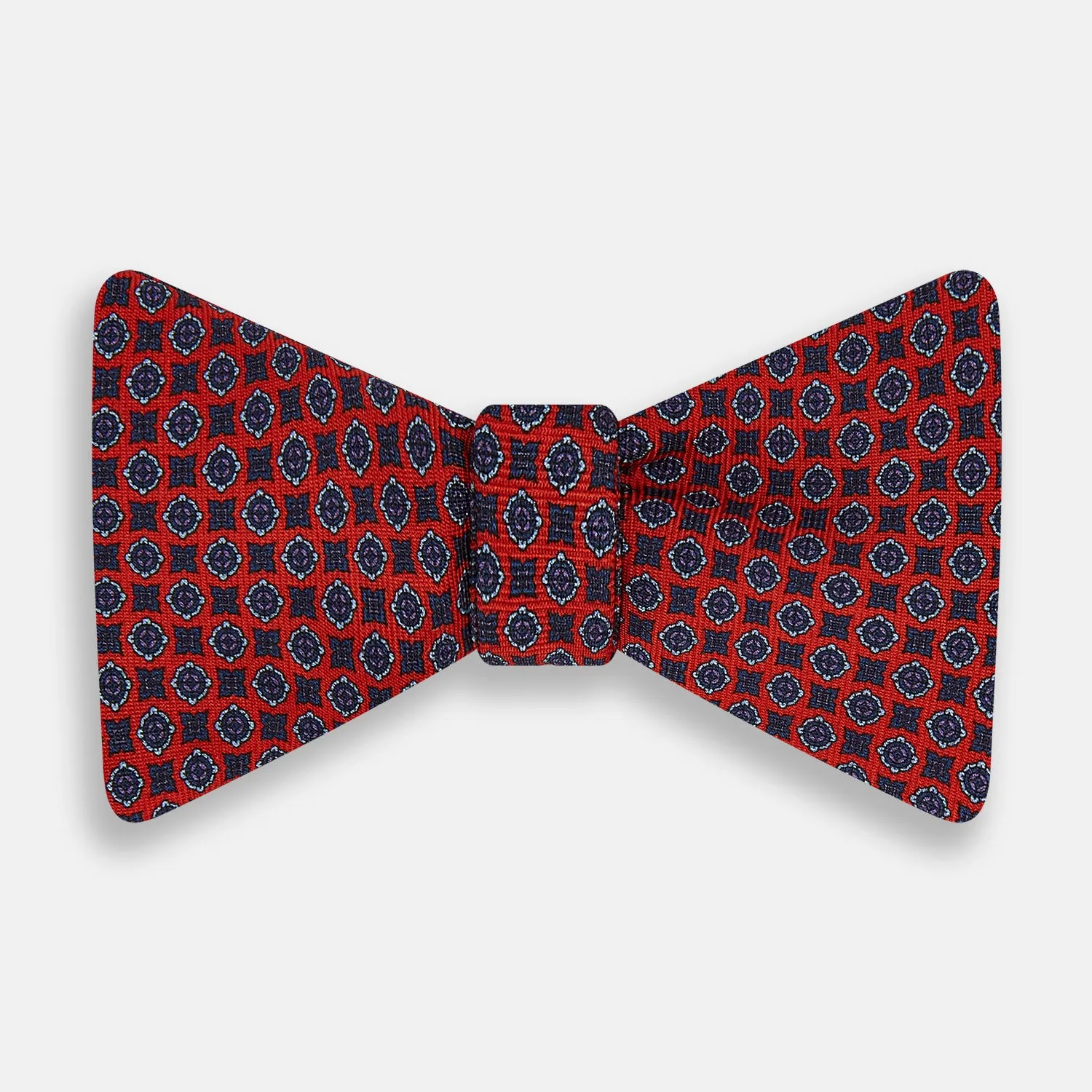 Red and Blue Geometric Floral Silk Bow Tie sold by Turnbull & Asser