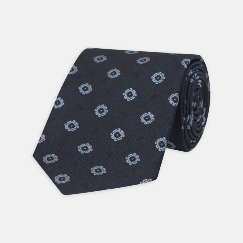 Navy and Light Blue Emblem Spot Silk Tie sold by Turnbull & Asser