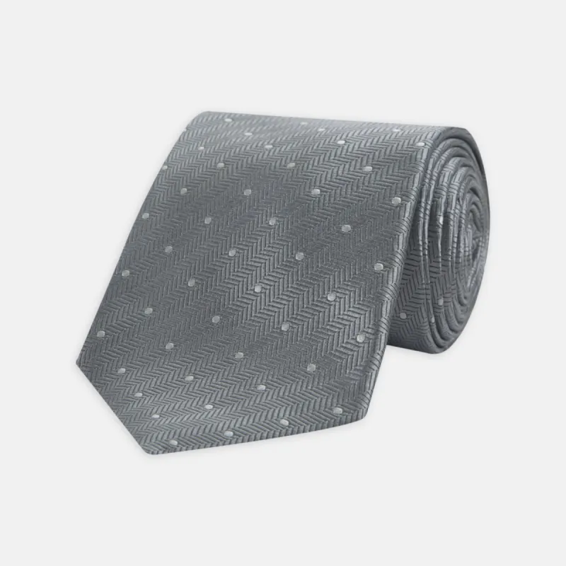 Grey and White Small Spot Herringbone Silk Tie sold by Turnbull & Asser