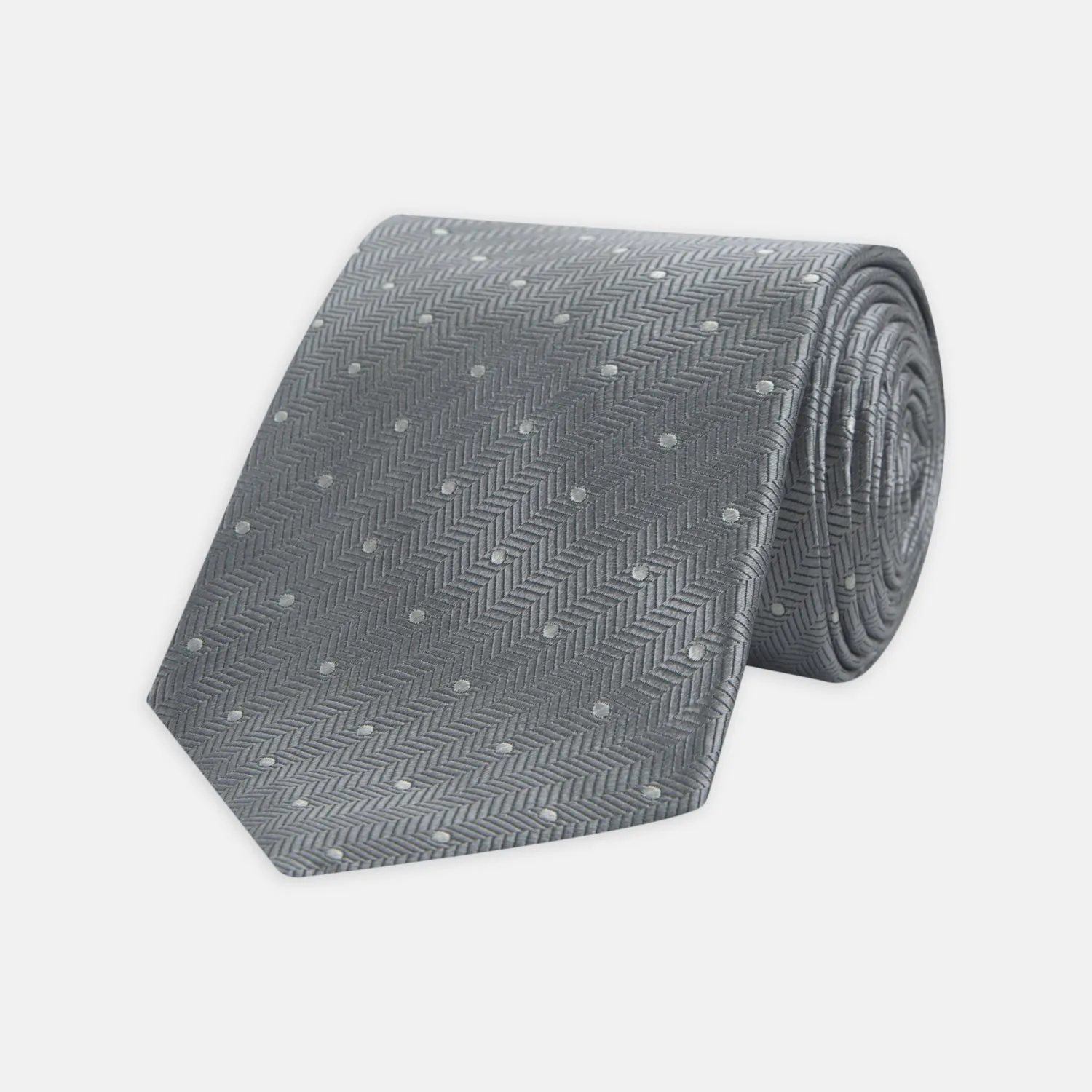 Grey and White Small Spot Herringbone Silk Tie sold by Turnbull & Asser