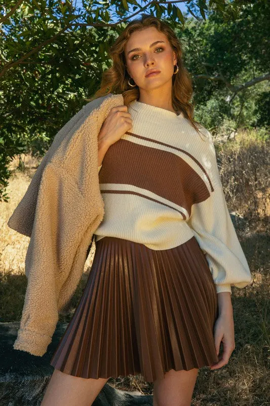 Pleated Faux Leather Skirt sold by U-NI-TY