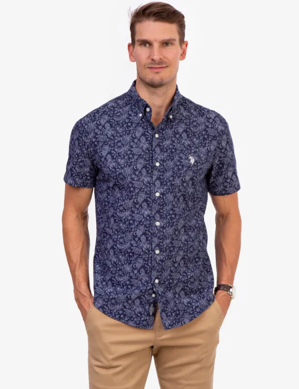 PRINTED FLORAL SLUB CANVAS SHIRT sold by U.S. Polo Assn.