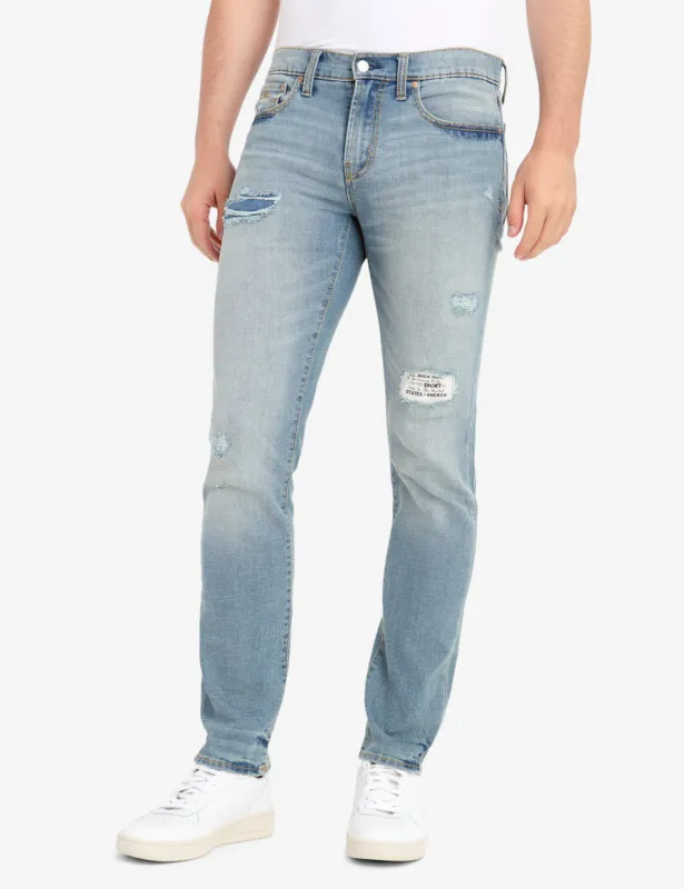 REPREVE® SKINNY FIT DISTRESSED JEANS WITH PATCH REPAIR made by U.S. Polo Assn.