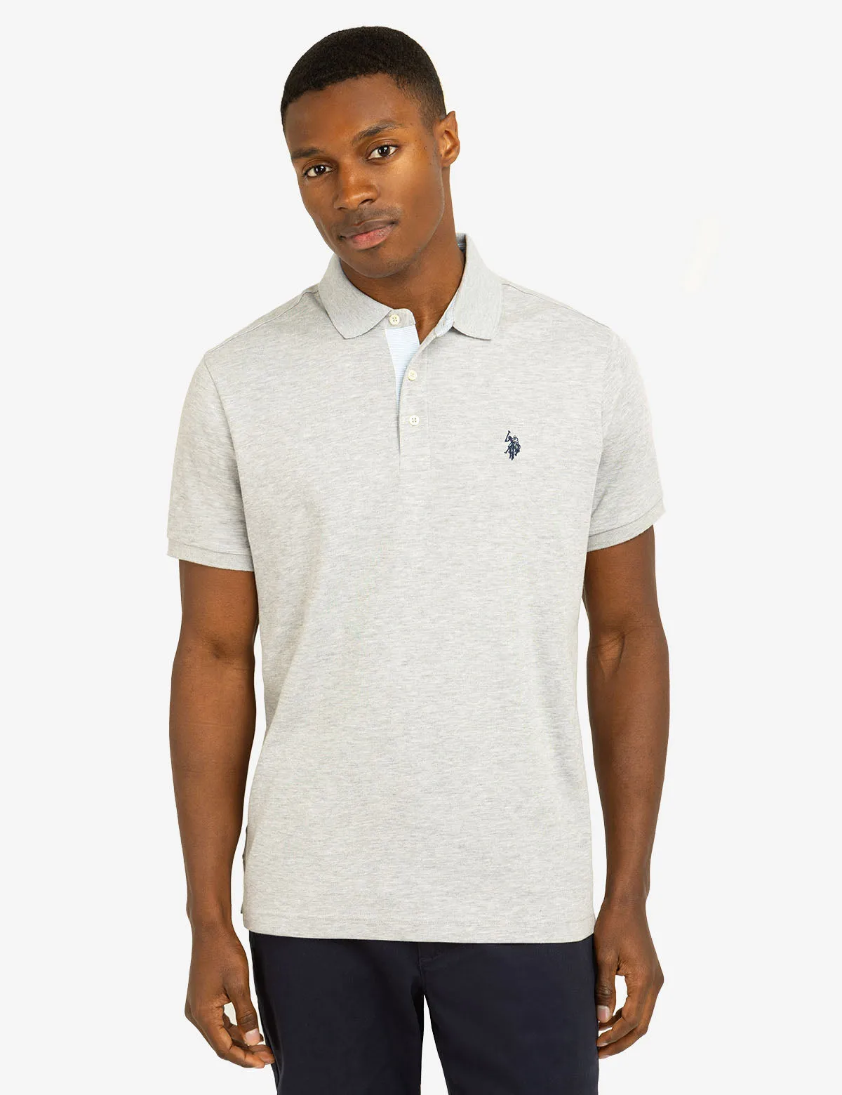SOLID INTERLOCK POLO SHIRT WITH WOVEN TRIM sold by U.S. Polo Assn.