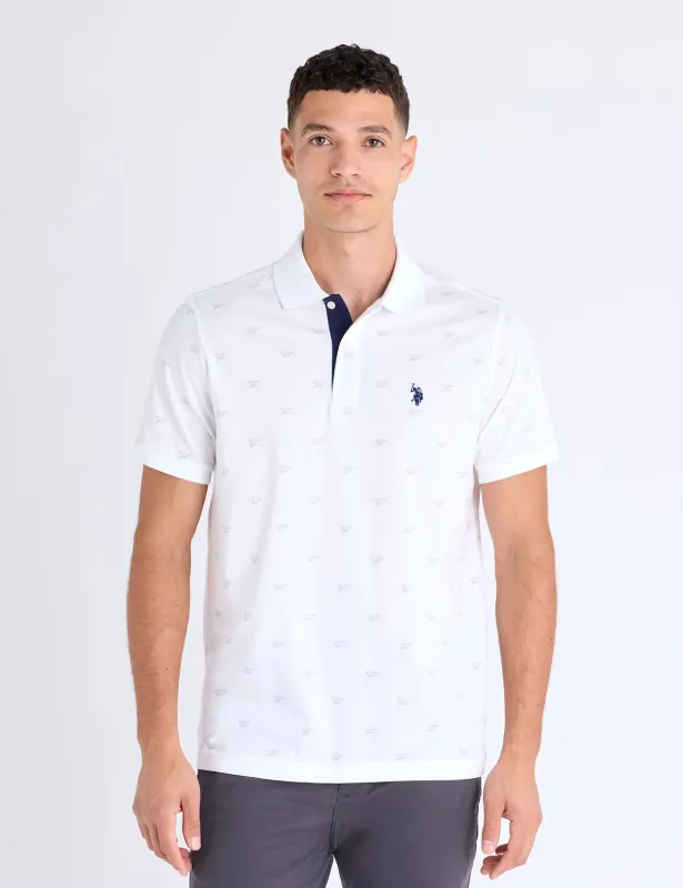 ALL OVER WORDMARK GRAPHIC PRINT JERSEY POLO SHIRT sold by U.S. Polo Assn.
