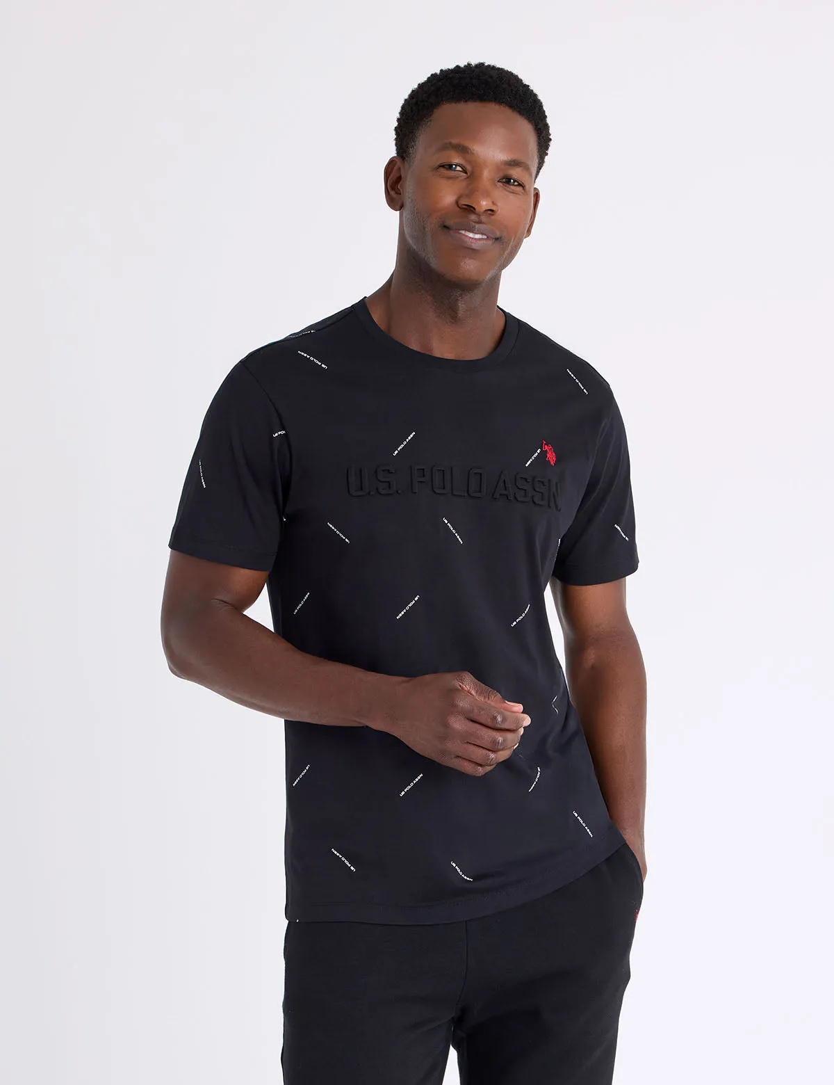 ALLOVER PRINT WORDMARK EMBOSSED T-SHIRT sold by U.S. Polo Assn.