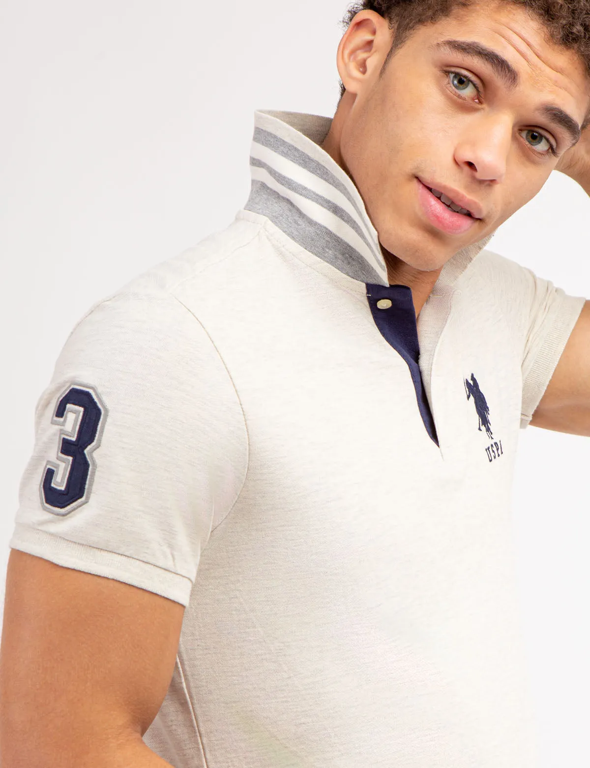 SLIM FIT STRETCH PIQUE POLO SHIRT sold by U.S. Polo Assn.