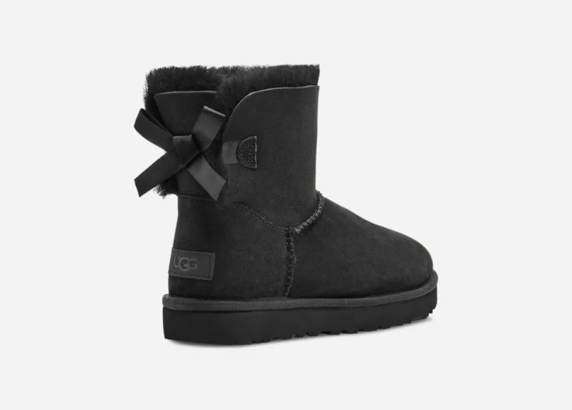 UGG® Mini Bailey Bow II Boot for Women in Black, Size 9, Shearling/Polyester/Leather sold by UGG