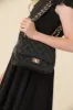 Mini Quilted Cross Body Bag in Black sold by Un Deux Trois