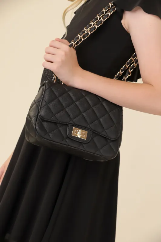 Mini Quilted Cross Body Bag in Black sold by Un Deux Trois