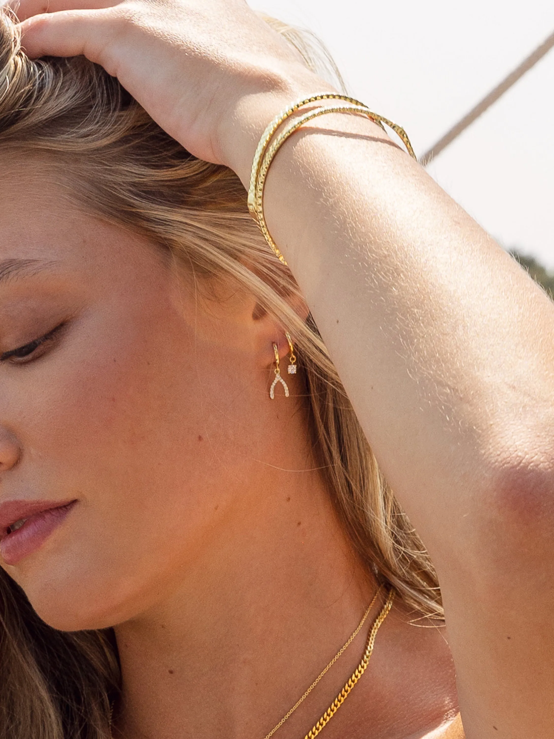 Pavé Wishbone Drop Huggie Earrings sold by Uncommon James product image thumbnail 3