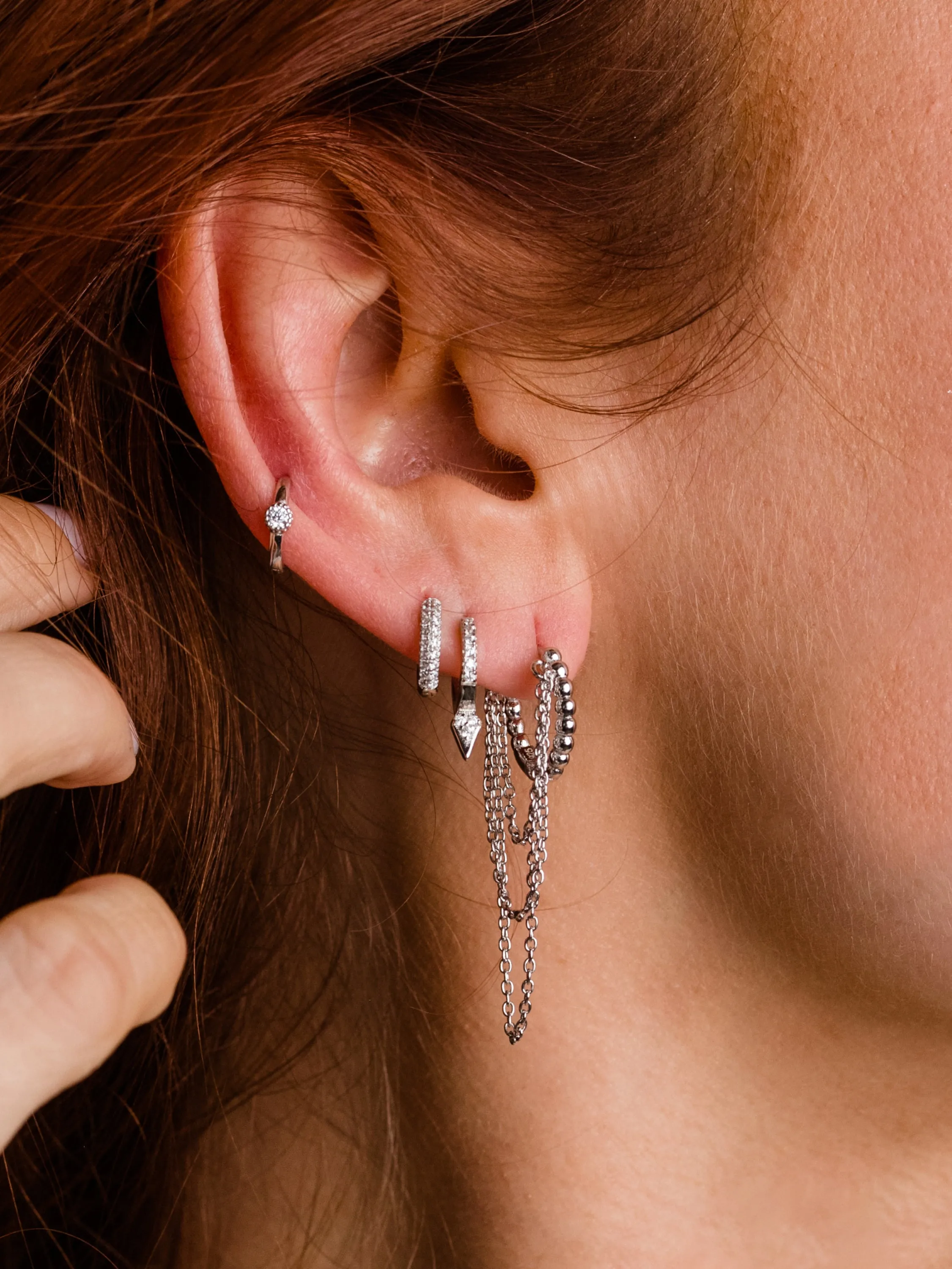 Tipping Point Pavé Huggie Earrings sold by Uncommon James product image thumbnail 3