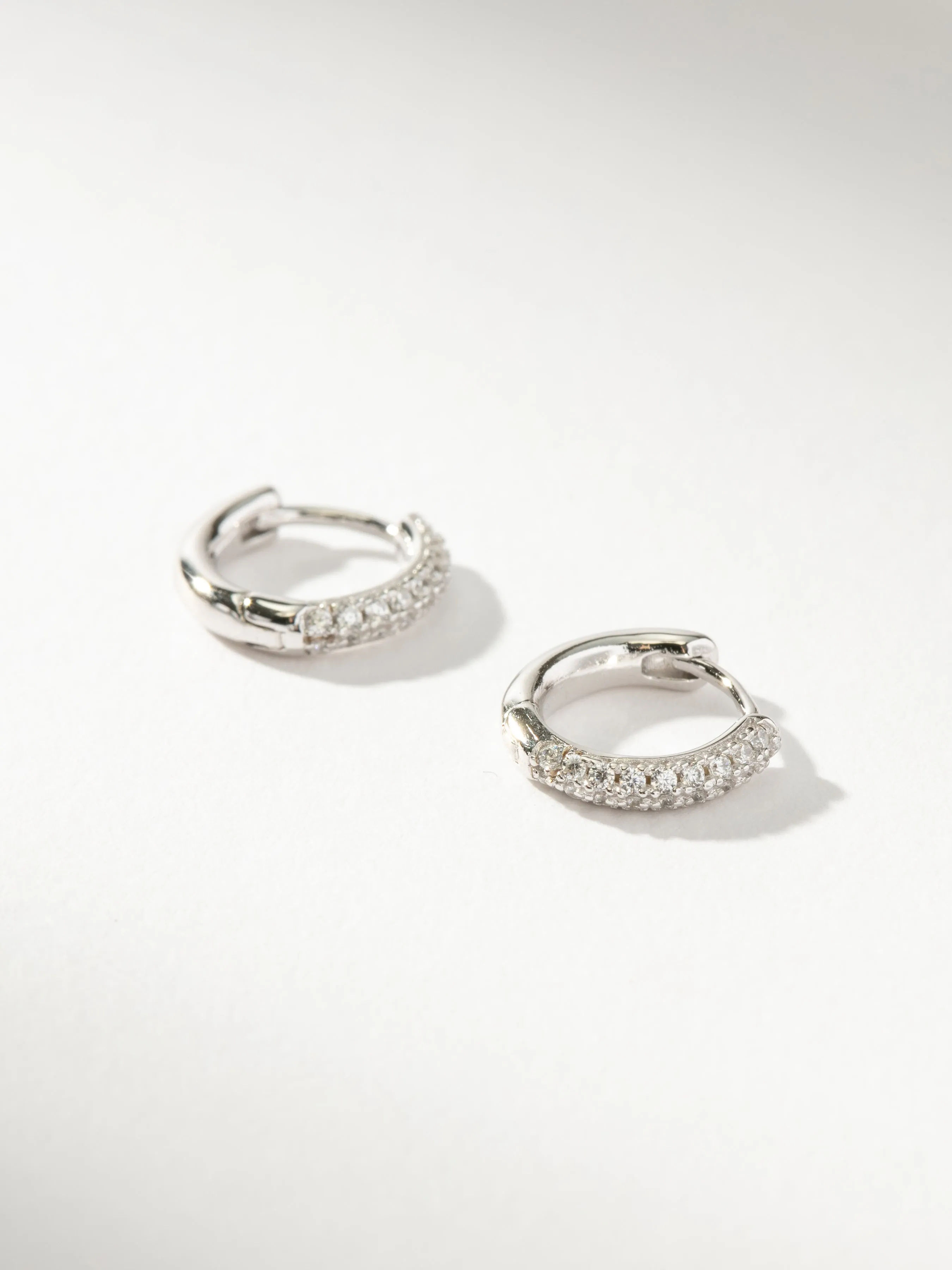 Luminous Pavé Huggie Earrings sold by Uncommon James