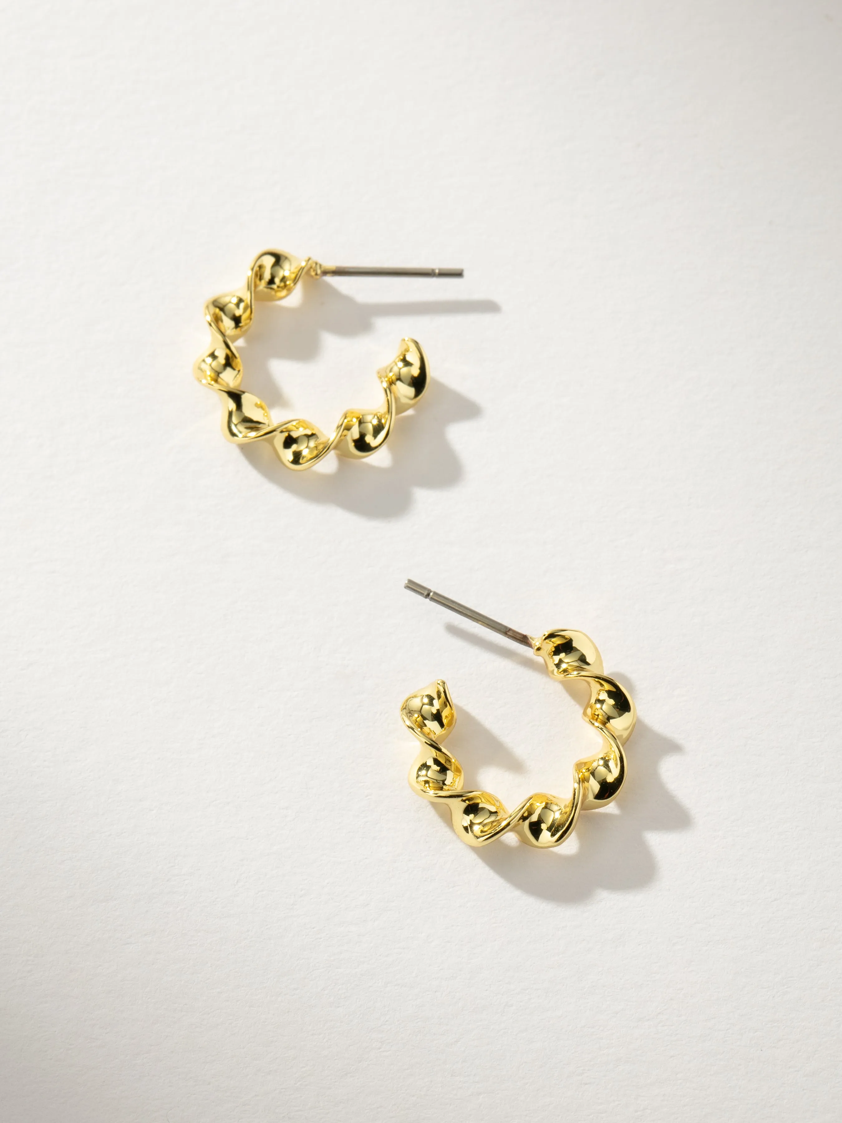 Twist Mini Hoop Earrings sold by Uncommon James