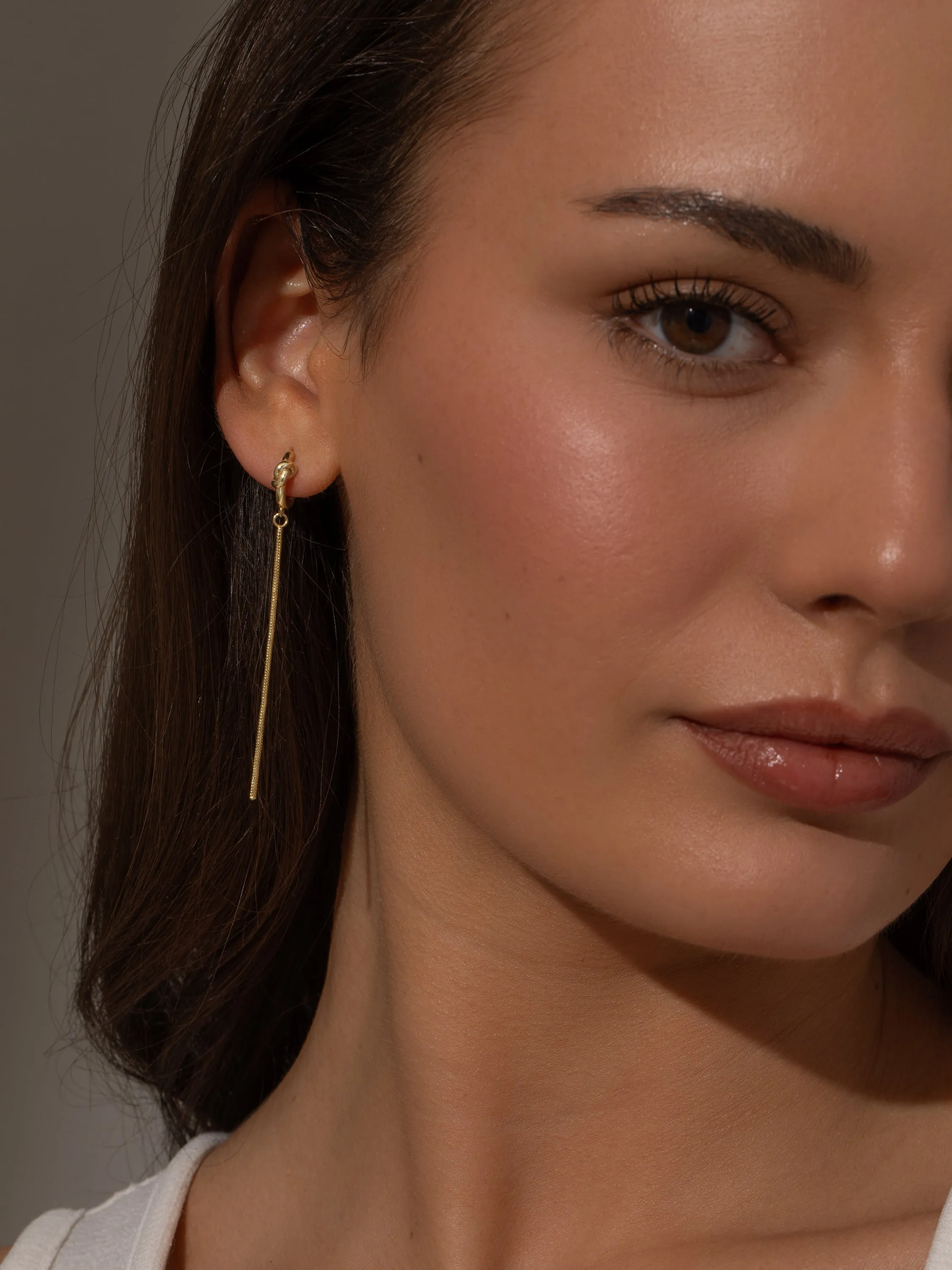 Forever Knot and Chain Huggie Earrings sold by Uncommon James product image thumbnail 5