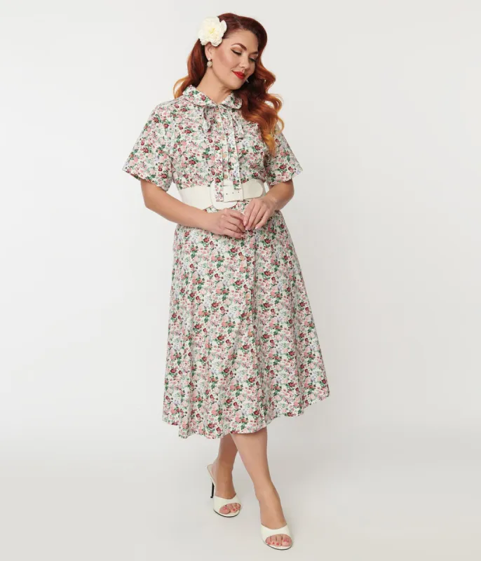 Plus Size 1940s Pink Floral Button Front Swing Dress sold by Unique Vintage