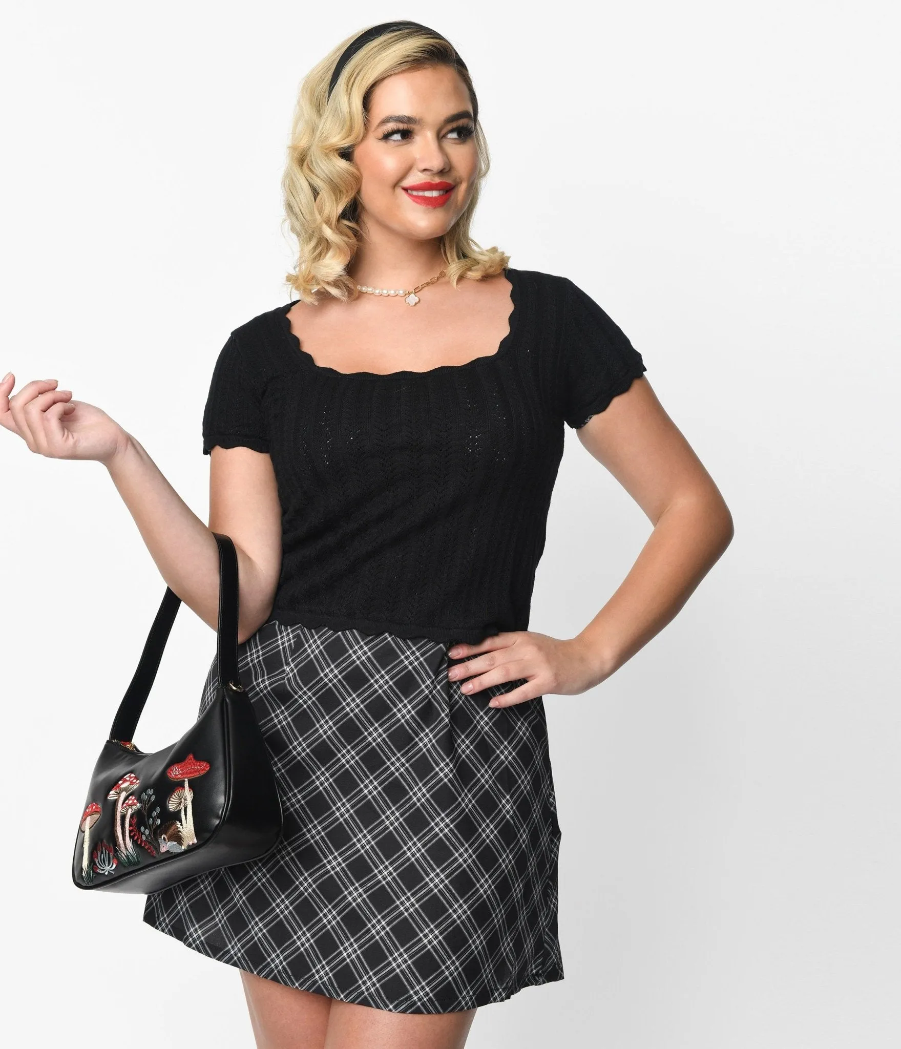 Black Ruffle Knit Top sold by Unique Vintage