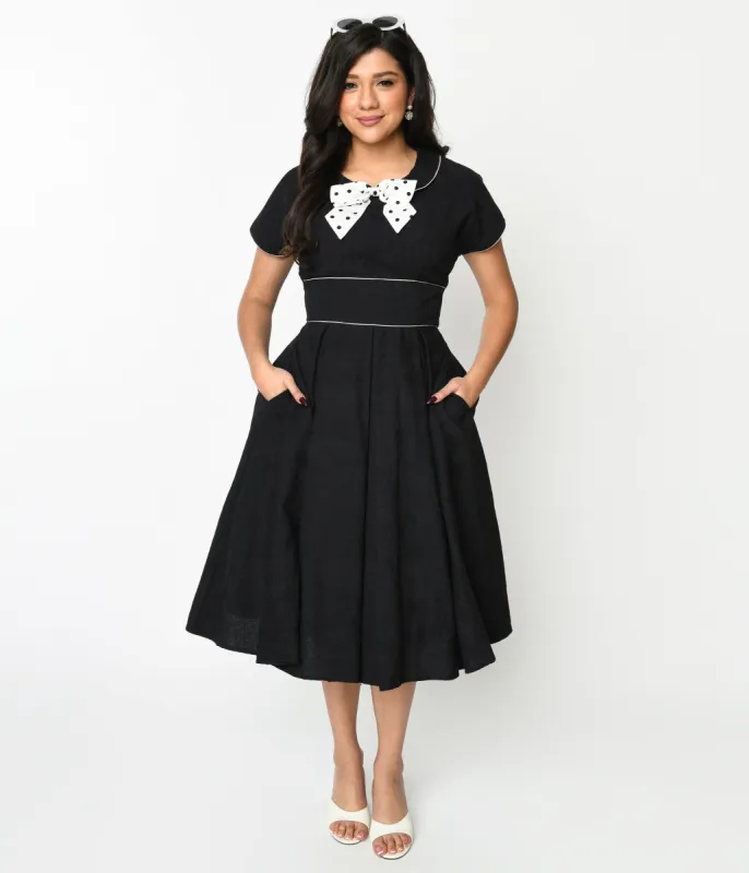 Unique Vintage 1950s Black & Ivory Polka Dot Bow Cotton Swing Dress sold by Unique Vintage