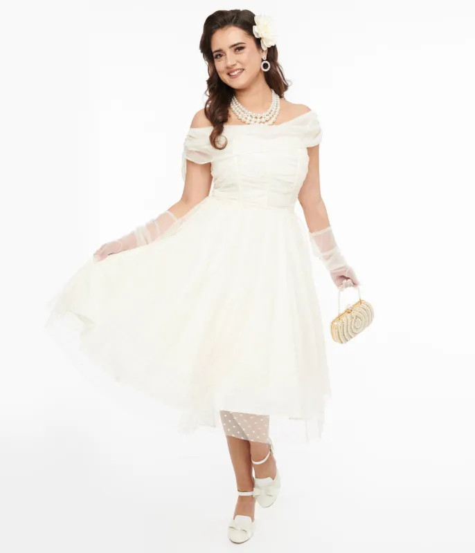 Unique Vintage 1950s Ivory Clip Dot Off The Shoulder Cocktail Dress sold by Unique Vintage