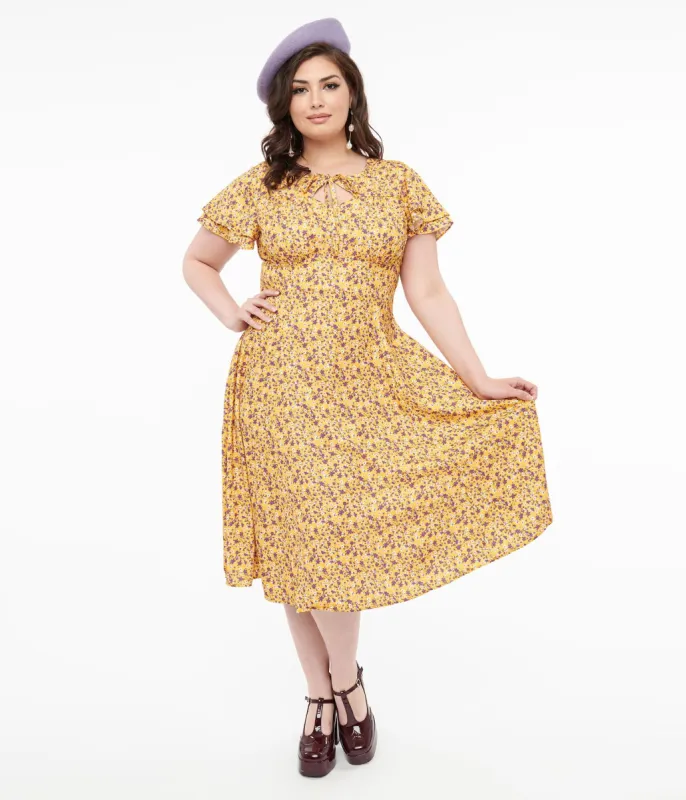 Plus Size 1950s Yellow & Purple Floral Capelet Swing Dress sold by Unique Vintage