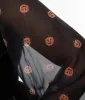Smak Parlour Plus Size 1970s Black & Pumpkin Bell Sleeve Bodysuit sold by Unique Vintage
