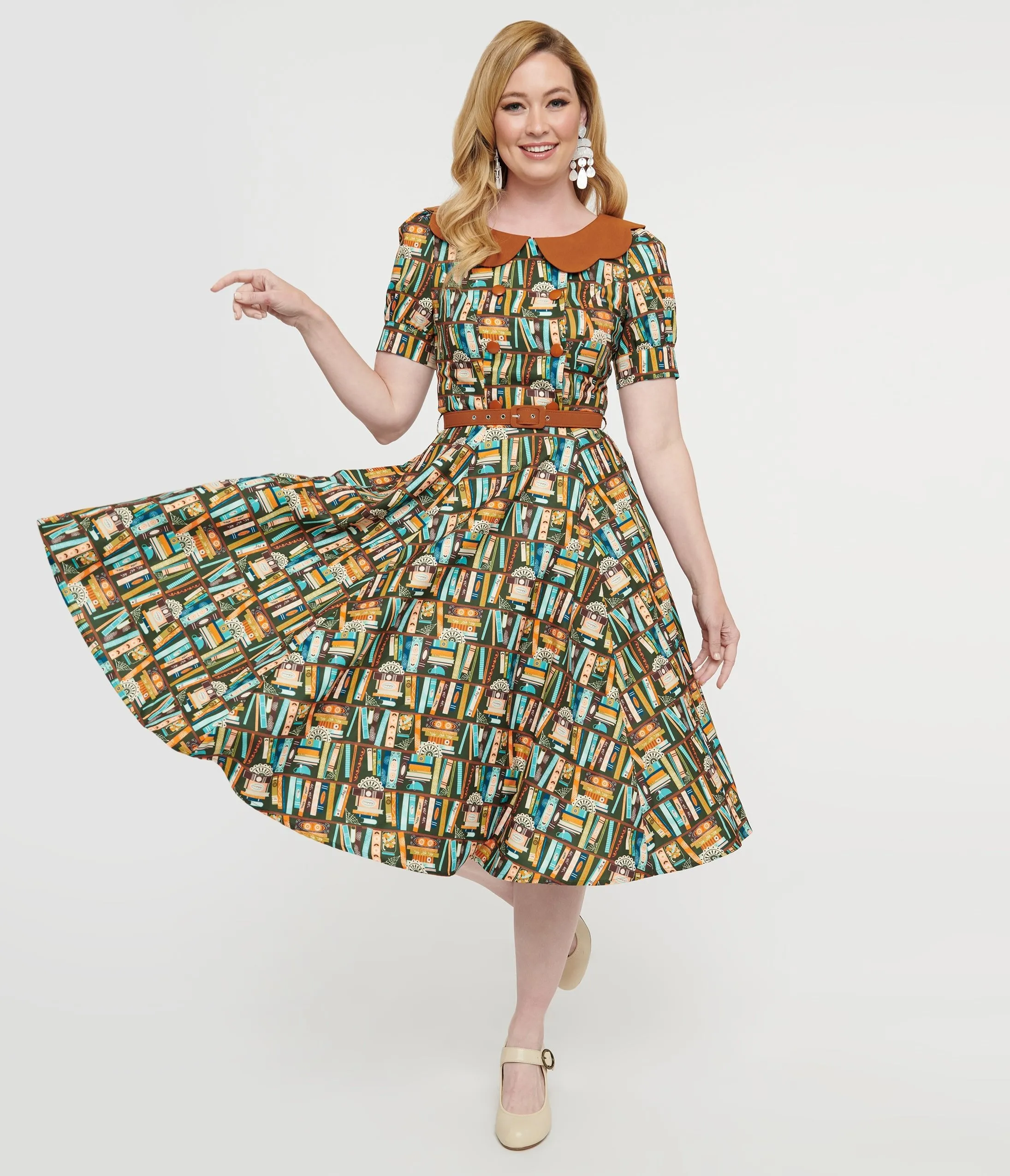 Collectif 1950s Brown Book Print Brenda Swing Dress sold by Unique Vintage