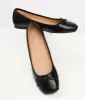 1960s Black Bow Ballet Flats sold by Unique Vintage